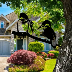 Metal bird silhouette tree insert detail view for outdoor garden decor and yard decoration.