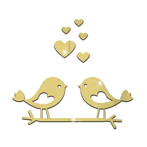 Details of gold acrylic mirror wall sticker featuring cute lovebirds, branch and hearts.