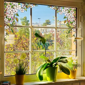 Decorative stained glass window film with cherry blossom pattern for privacy and home decor.