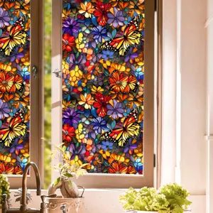 Detailed view of colorful stained glass window film with floral and butterfly patterns for home decor.