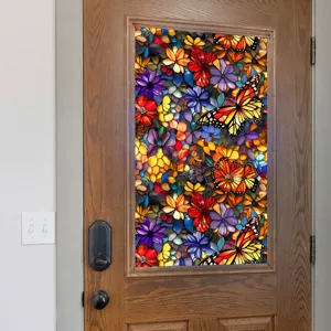 Stained glass window film detail showing colorful floral and butterfly pattern on door glass.