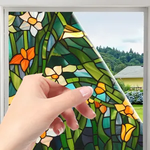 Stained glass window film featuring a beautiful floral pattern, perfect for privacy and home decor.