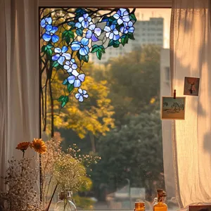 Detail view of the stained glass window film featuring blue floral vine pattern on glass pane.