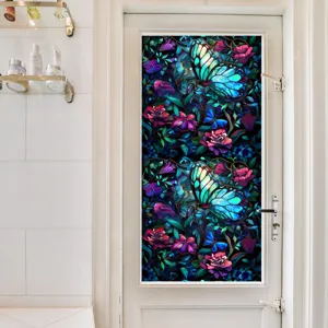 Decorative stained glass window film with vibrant blue butterfly and floral pattern for privacy.