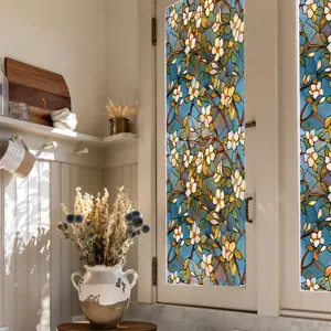 Decorative stained glass window film with elegant floral pattern for home privacy and decor.