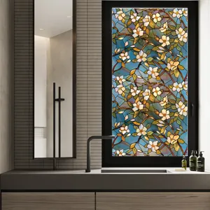 Stained glass window film detail showing vibrant floral botanical pattern applied on bathroom window.