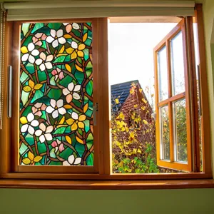 Stained glass window film with floral pattern, decorative glass sticker for home use.
