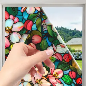 Stained glass window film detail showing floral pattern and easy peel application for home decor.