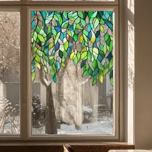 Decorative stained glass window film with green leaf pattern for privacy and home decor.