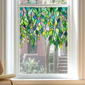 Detailed view of the stained glass window film featuring green leaves pattern for home decor.