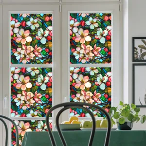 Decorative stained glass window film scene showing colorful floral patterns for home privacy.