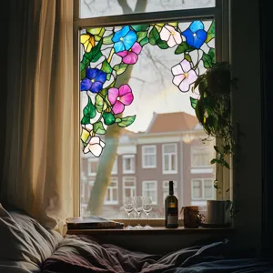 Detail view of colorful floral stained glass window film, beautiful light effect for room decor.