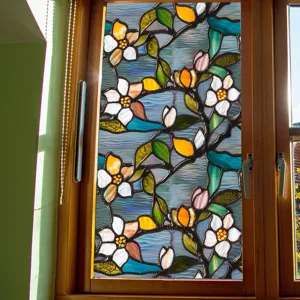 Decorative stained glass window film with vibrant floral pattern for home privacy.