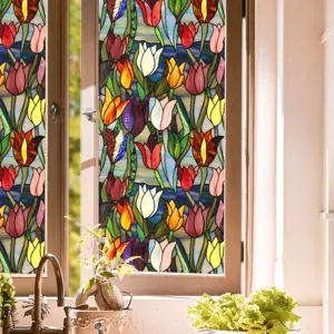 Detailed close-up shot of colorful stained glass window film featuring tulip flower pattern.