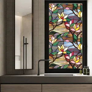 Detailed view of stained glass floral window film beautifully applied on modern bathroom glass.