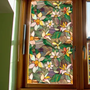 Detail view of stained glass floral window film, elegant flower pattern for home privacy.