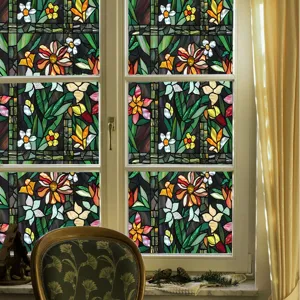 Detailed view of stained glass window film featuring vibrant floral patterns and elegant leaves.