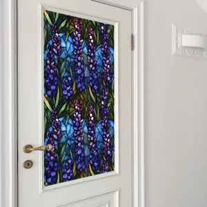 Stained glass window film detail showing vibrant purple floral pattern applied on glass door.