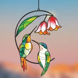 Close-up of stained glass hummingbird hanging ornament, vibrant colors and metal frame details.
