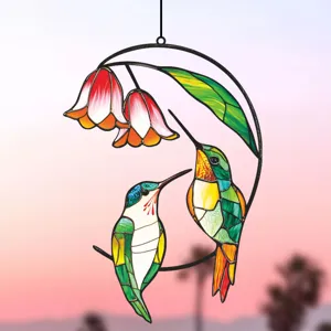 Detailed view of colorful stained glass hummingbird metal hanging ornament for window wall decor.