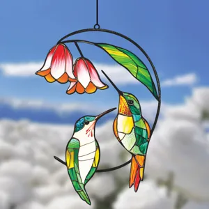 Close-up detail of double-sided hummingbird stained glass hanging ornament for decor.