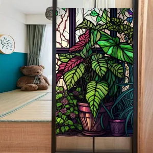 Detailed view of botanical stained glass window film applied on partition glass, home decor.