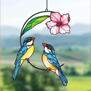 Metal stained glass bird hanging window decor detail showing dual birds and pink flower art.