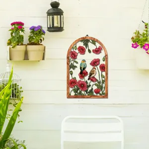 Detail view of the arched wooden metal wall hanging featuring birds and red poppy decor.