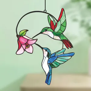Detailed view of stained glass hummingbird hanging ornament, vibrant colors, window decor.