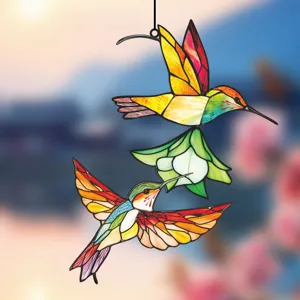 Detailed close up view of colorful stained glass hummingbird hanging ornament decoration