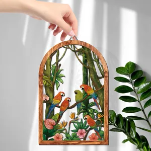 Close up of wooden wall decor featuring tropical jungle parrots and floral design in arch shape.