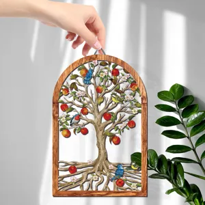 Detailed view of wooden arched wall hanging featuring intricate tree and bird design for home decor.
