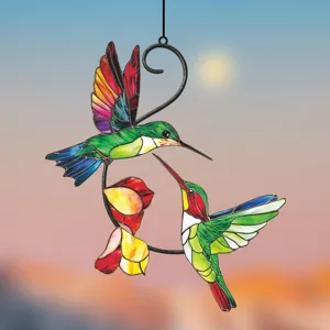 Close-up of double hummingbird stained glass style hanging window decor detail display