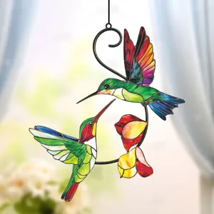 Stained glass style double hummingbird hanging decor detail shot showing vibrant multi-color metal craft.