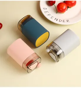 Automatic pop-up toothpick holder detail view, press-type plastic storage box for home table use.