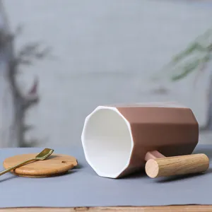 Nordic ceramic coffee mug with wooden handle, geometric design, elegant cup lid and spoon.
