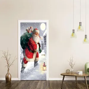 Detalle de vinilo para puerta 3D de Navidad con Papá Noel en la nieve para decoración.