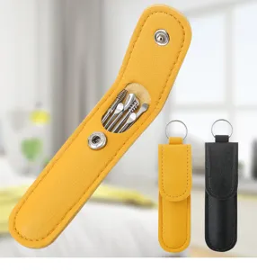 Portable stainless steel ear pick cleaning tool set in colourful PU leather case detail.