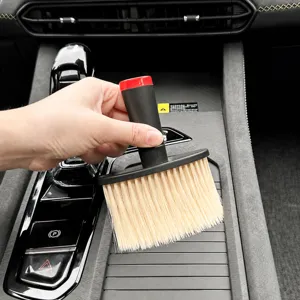 Car interior cleaning brush for air vent and gap dusting, soft bristle auto detailing tool.