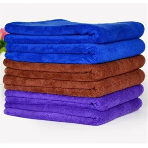 Thickened microfiber car washing towels in blue brown and purple stacked neatly for efficient use.