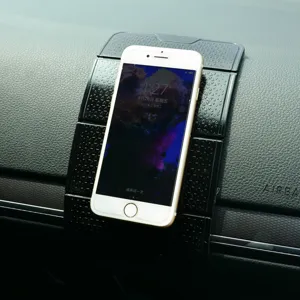 Multifunctional car anti-slip dashboard mat with folding phone holder, heat-resistant.