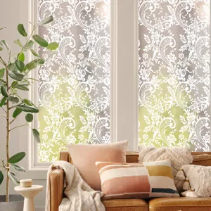 Decorative static glass window film with elegant white lace pattern for home decor.
