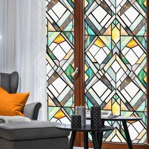 Detail view of colorful geometric stained glass window film applied on home door, indoor decor.