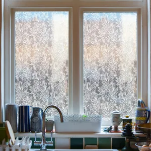 Detailed view of elegant white lace window film, static cling decorative glass sticker for home.