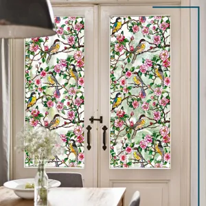 Film décoratif pour vitre en verre teinté avec motif floral et oiseau pour la maison.