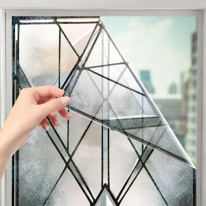 Geometric window film detail showing frosted texture and static cling application on glass pane.