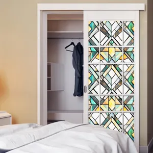 Decorative window glass film with stained geometric art design for home privacy and style.