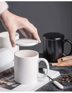 White ceramic coffee mug with lid and spoon, perfect for office and daily tea use.