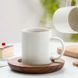 Simple ceramic coffee mug with wooden saucer, white tea cup for office and home use.