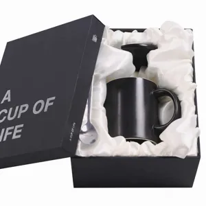 Ceramic coffee mug set with gift box, elegant black design for office and business gifts.